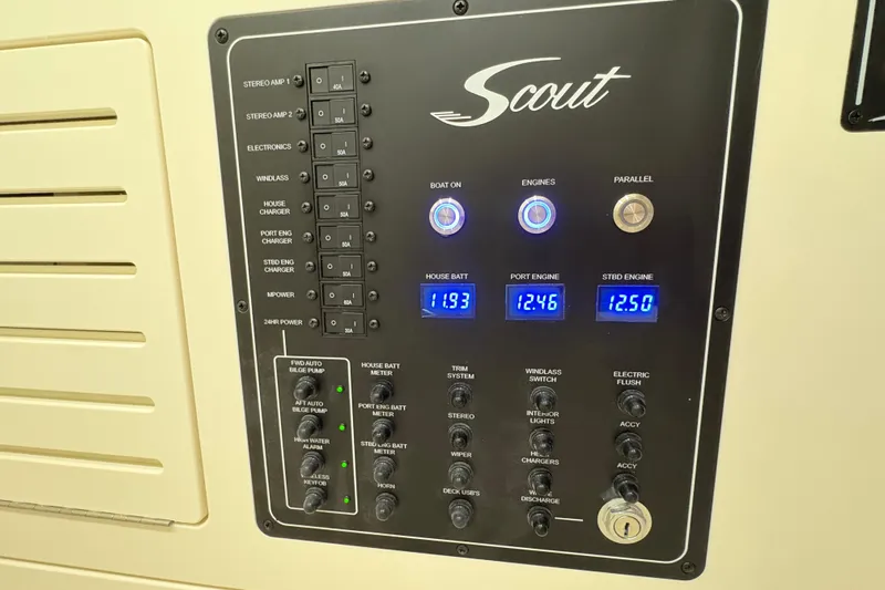  Yacht Photos Pics Control panel of 2026 Scout 288 LXF boat with digital displays and switches.