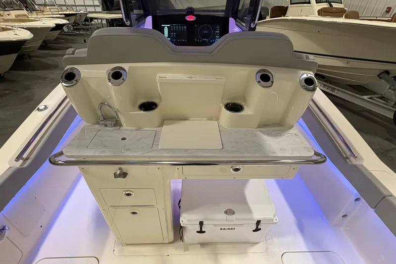  Yacht Photos Pics Interior view of 2026 Scout 288 LXF boat with modern dashboard and storage compartments.