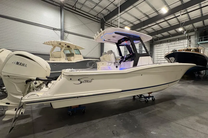  Yacht Photos Pics 2026 Scout 288 LXF boat in showroom, featuring Yamaha engine, sleek design.