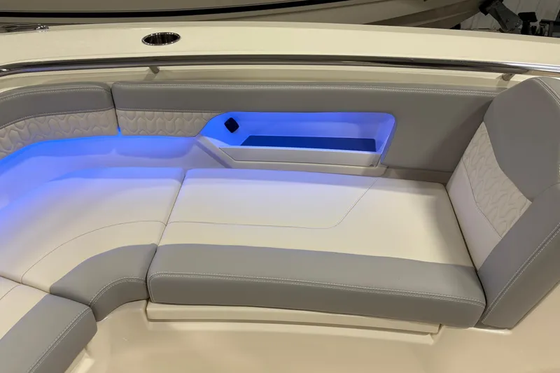  Yacht Photos Pics 2026 Scout 288 LXF boat interior with blue LED lighting and cushioned seating.