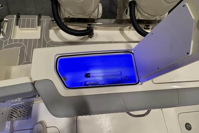  Yacht Photos Pics 2026 Scout 288 LXF boat with illuminated storage compartment and sleek interior design.
