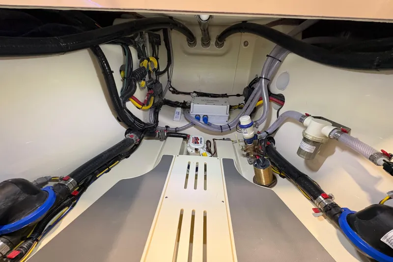  Yacht Photos Pics Engine compartment of 2026 Scout 288 LXF boat, showcasing wiring and components.