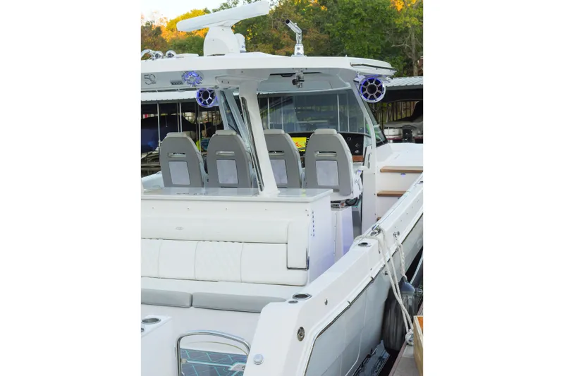 Only Fins Yacht Photos Pics 2021 Regal 38 SAV boat interior with modern seating and advanced navigation equipment.