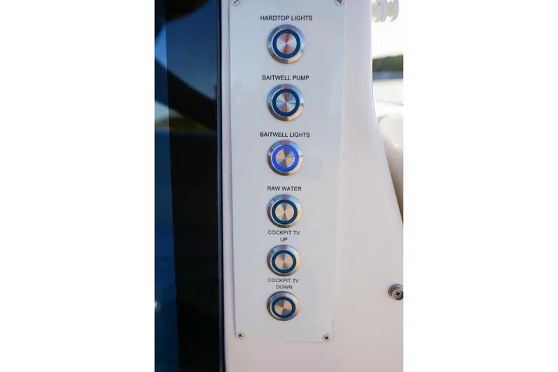 Only Fins Yacht Photos Pics Control panel on 2021 Regal 38 SAV boat with labeled buttons for various functions.