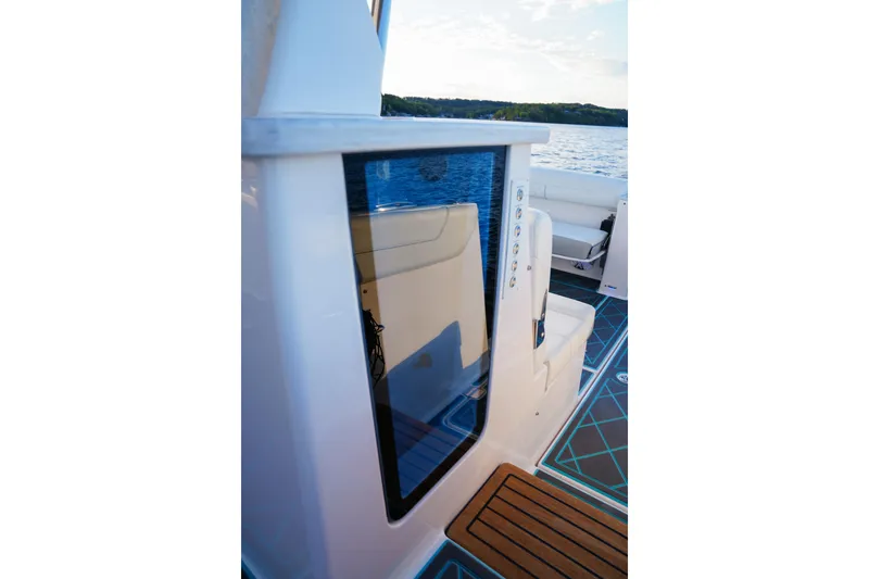 Only Fins Yacht Photos Pics 2021 Regal 38 SAV boat interior with modern seating and sleek design.
