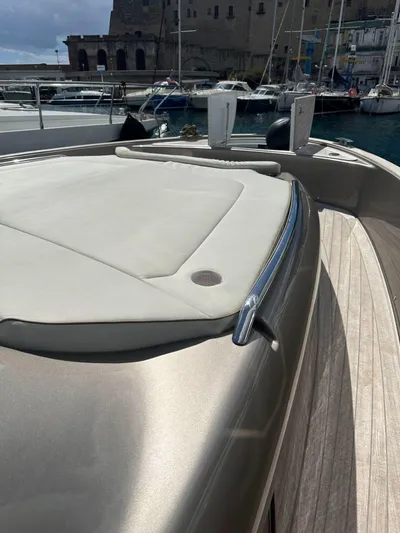  Yacht Photos Pics 2024 Solaris Power 44 Open yacht with sleek deck design in marina setting.