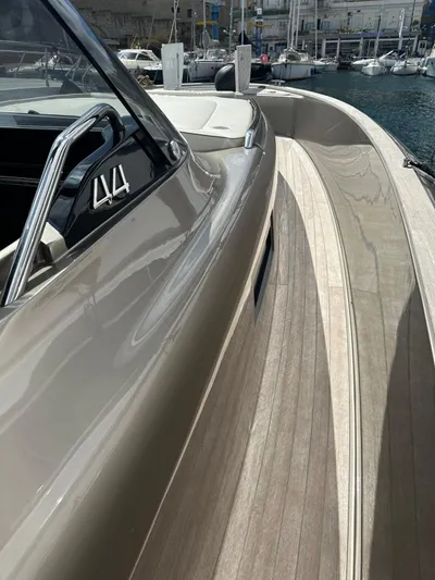  Yacht Photos Pics 2024 Solaris Power 44 Open yacht with sleek design and wooden deck details.