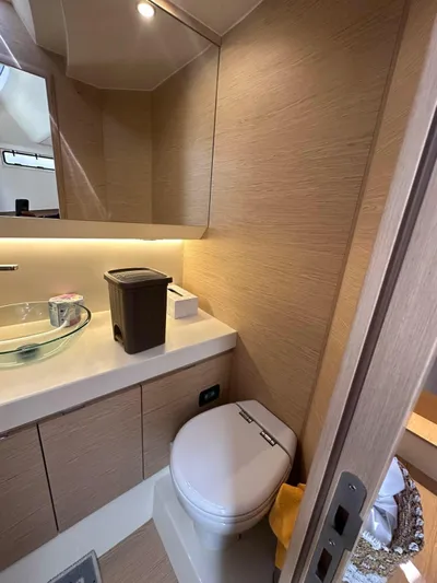  Yacht Photos Pics 2024 Solaris Power 44 Open yacht bathroom with modern fixtures and wood accents.