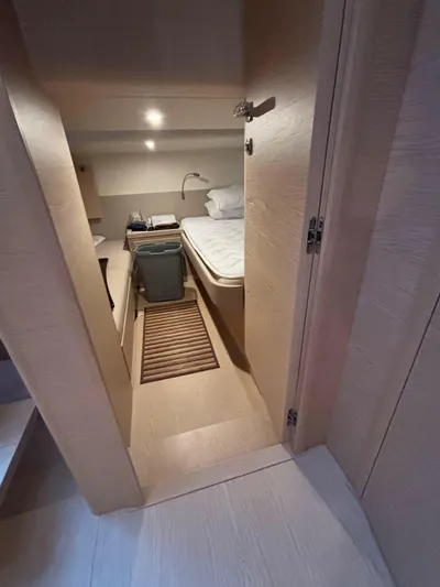  Yacht Photos Pics 2024 Solaris Power 44 Open cabin interior with bed, wooden flooring, and modern lighting.