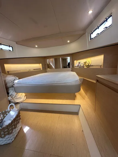  Yacht Photos Pics 2024 Solaris Power 44 Open yacht interior with modern design and cozy sleeping area.