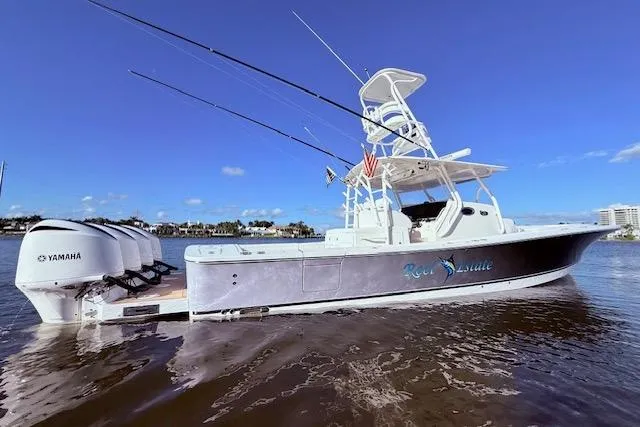  Yacht Photos Pics 2017 Regulator 41 boat with Yamaha engines on calm water under clear blue sky.