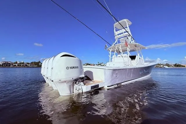  Yacht Photos Pics 2017 Regulator 41 boat with Yamaha engines on calm water under clear blue sky.