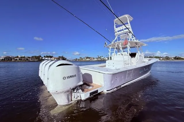  Yacht Photos Pics 2017 Regulator 41 boat with Yamaha engines on calm water under clear blue sky.