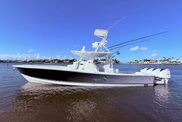  Yacht Photos Pics 2017 Regulator 41 boat on water, clear sky, fishing rods visible.