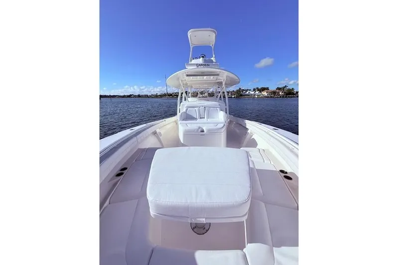  Yacht Photos Pics 2017 Regulator 41 boat with white seating, on calm water under a clear blue sky.