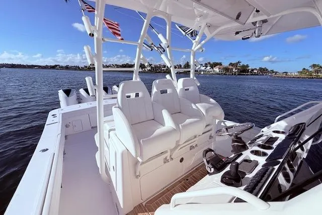  Yacht Photos Pics 2017 Regulator 41 boat interior with white seating, rod holders, and ocean view.