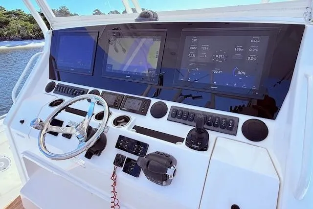  Yacht Photos Pics Control panel of a 2017 Regulator 41 boat with advanced navigation displays.