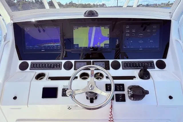 Yacht Photos Pics Control panel of a 2017 Regulator 41 boat with advanced navigation displays.
