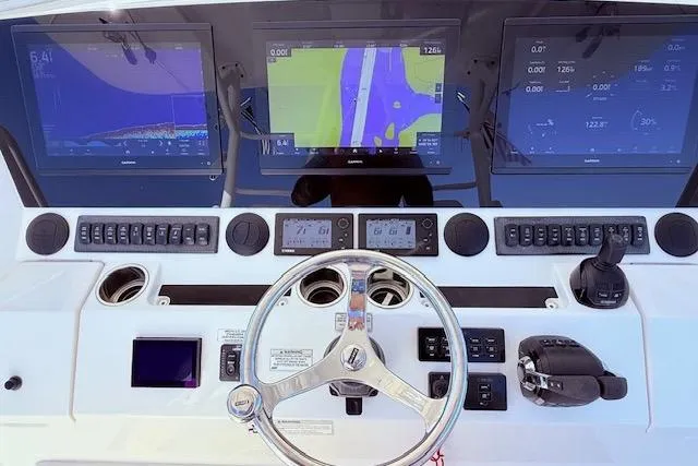  Yacht Photos Pics 2017 Regulator 41 boat dashboard with navigation screens and controls.