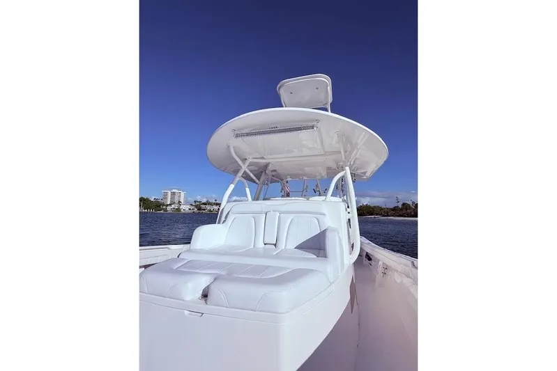  Yacht Photos Pics 2017 Regulator 41 boat with sleek white seating and canopy on a sunny day.