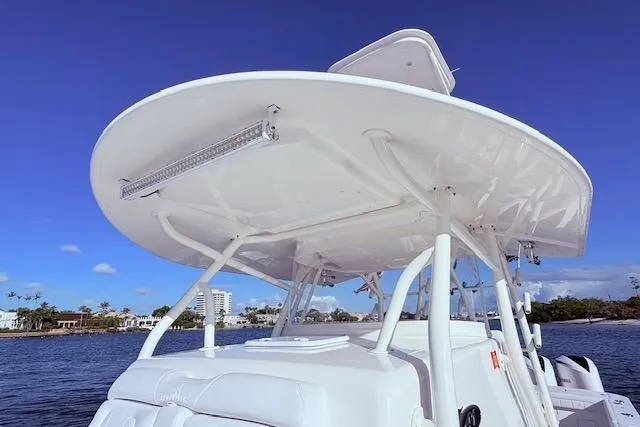  Yacht Photos Pics 2017 Regulator 41 boat with T-top, under clear blue sky, near waterfront.