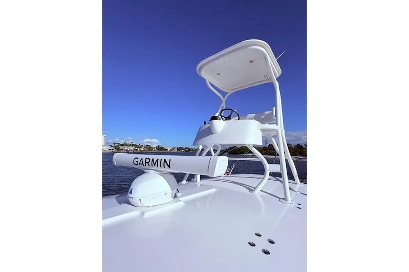  Yacht Photos Pics 2017 Regulator 41 boat with Garmin radar, clear blue sky background.