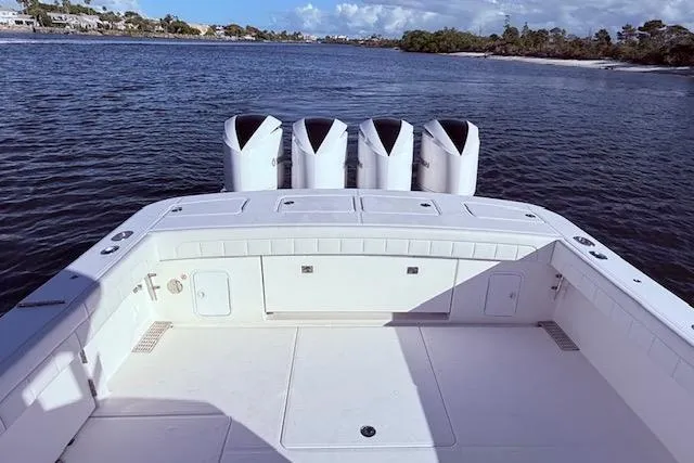  Yacht Photos Pics 2017 Regulator 41 boat with quad engines on a calm waterway.