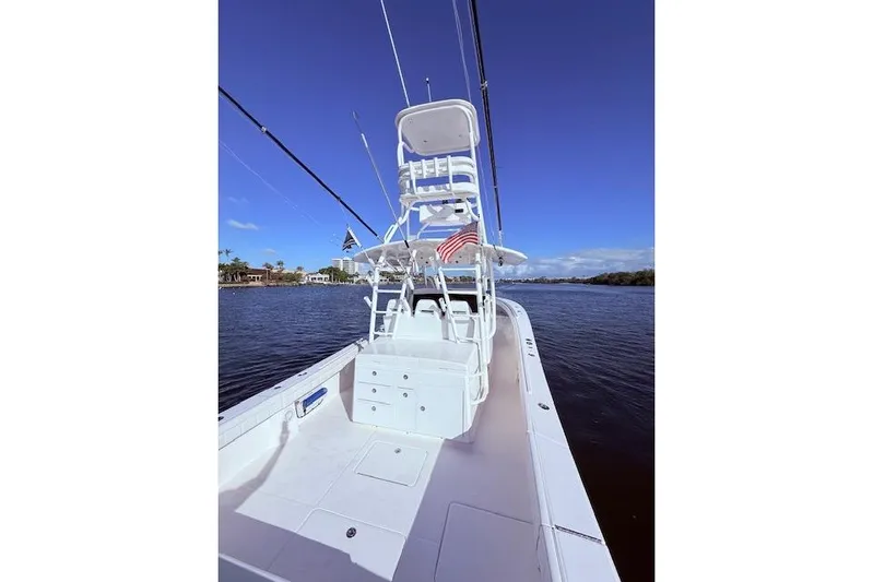  Yacht Photos Pics 2017 Regulator 41 boat on water, featuring a spacious deck and tower under clear blue skies.
