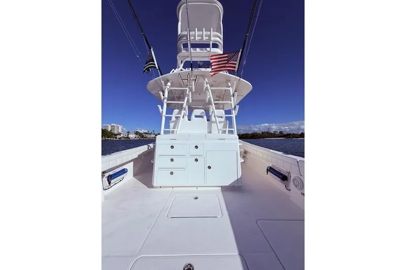  Yacht Photos Pics 2017 Regulator 41 boat deck with tower, American flag, and clear blue sky.