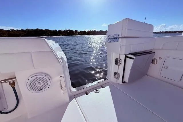  Yacht Photos Pics 2017 Regulator 41 boat interior with water view, featuring seating and speaker.