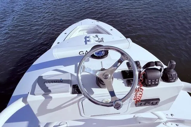  Yacht Photos Pics 2017 Regulator 41 boat helm with Garmin navigation system on calm water.