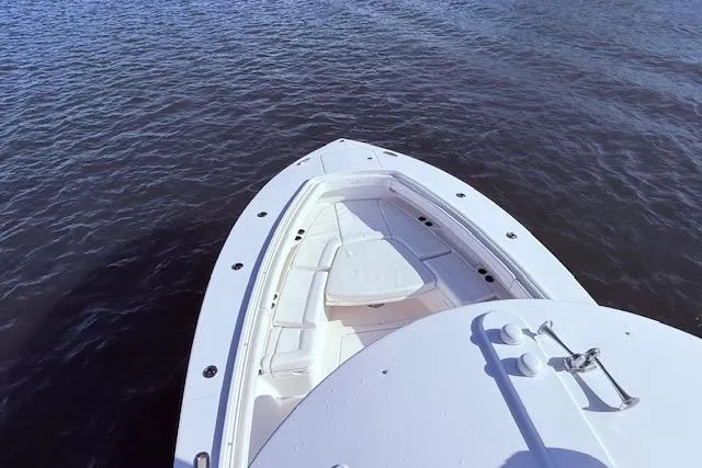  Yacht Photos Pics 2017 Regulator 41 boat bow on calm water, showcasing sleek design and spacious seating.