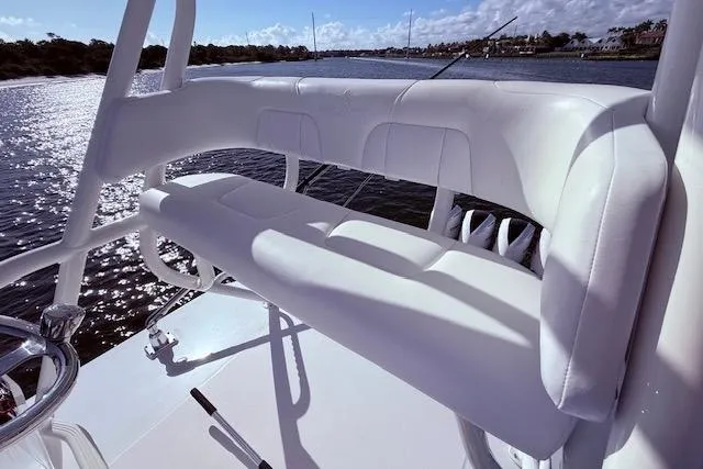  Yacht Photos Pics 2017 Regulator 41 boat with white seating, overlooking a scenic waterway.