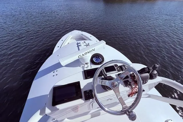  Yacht Photos Pics 2017 Regulator 41 boat helm with Garmin navigation on calm water.