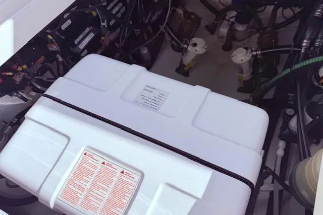  Yacht Photos Pics Engine compartment of a 2017 Regulator 41 boat, showcasing battery and wiring components.