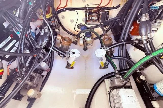  Yacht Photos Pics Engine compartment of a 2017 Regulator 41 boat, showcasing complex wiring and components.