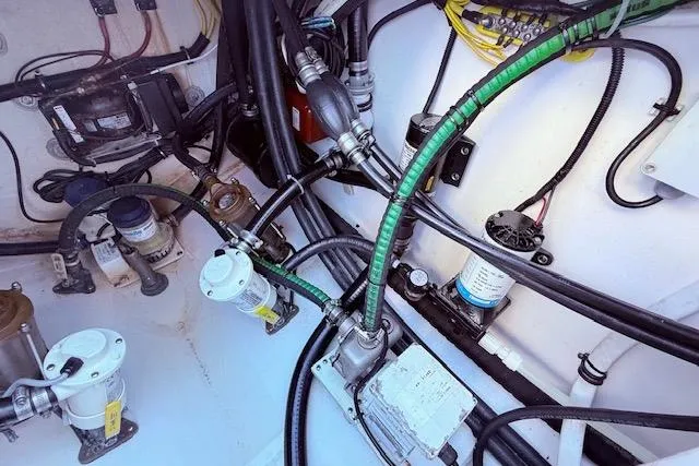  Yacht Photos Pics Engine compartment of a 2017 Regulator 41 boat, showcasing wiring and mechanical components.