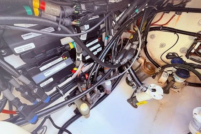  Yacht Photos Pics Engine compartment of a 2017 Regulator 41 boat, showcasing wiring and mechanical components.