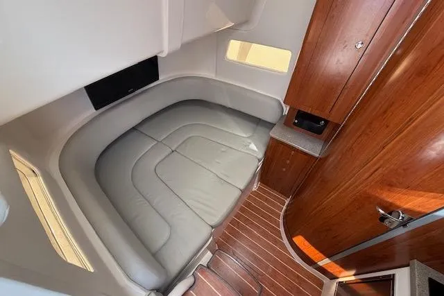  Yacht Photos Pics 2017 Regulator 41 cabin interior with wood accents and cushioned seating.