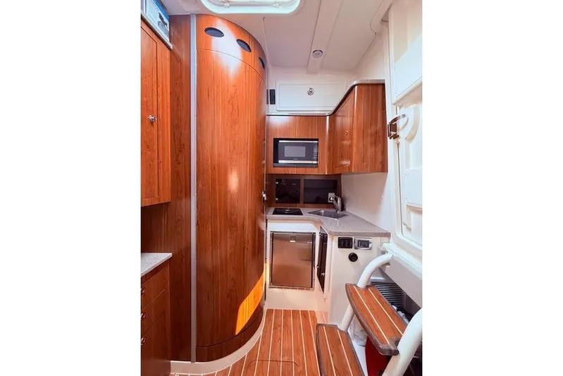  Yacht Photos Pics Luxurious 2017 Regulator 41 yacht interior with modern kitchen and wooden cabinetry.