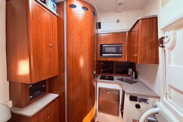  Yacht Photos Pics Luxurious 2017 Regulator 41 yacht interior with wood cabinetry and modern kitchen amenities.
