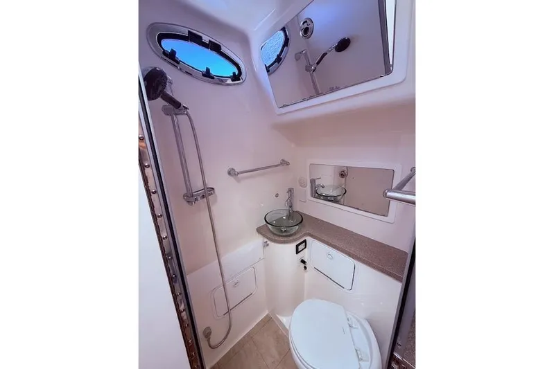  Yacht Photos Pics 2017 Regulator 41 boat bathroom with shower, sink, and toilet.