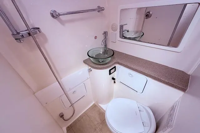  Yacht Photos Pics Luxurious bathroom in 2017 Regulator 41 boat with modern fixtures and glass sink.