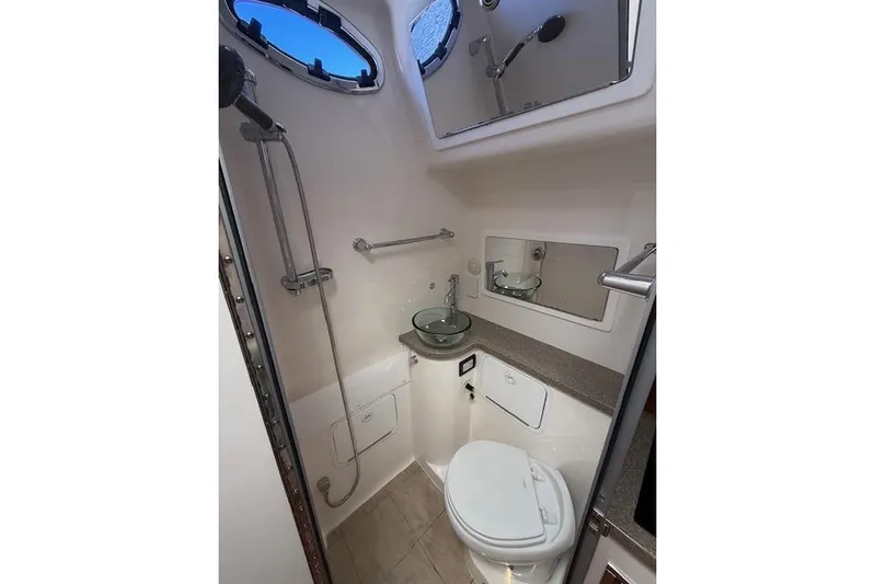  Yacht Photos Pics 2017 Regulator 41 boat bathroom with shower, sink, and toilet.
