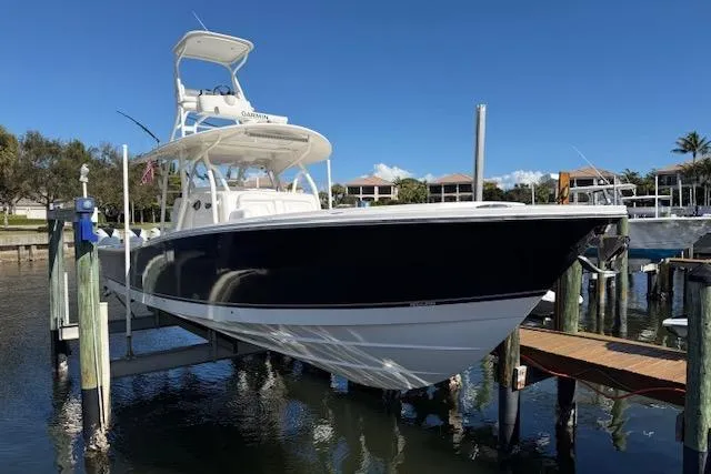  Yacht Photos Pics 2017 Regulator 41 boat docked, featuring sleek design and elevated helm station.