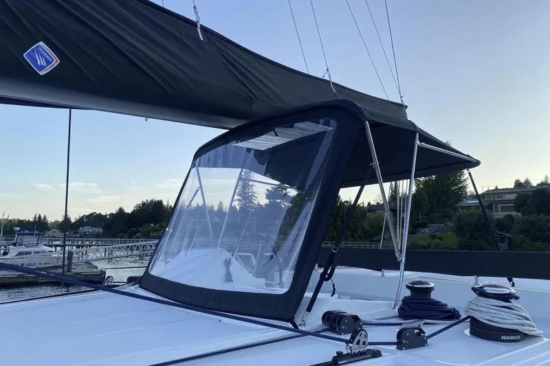 Why Not Yacht Photos Pics 2019 Lagoon 450F catamaran with black sail cover, docked at marina.