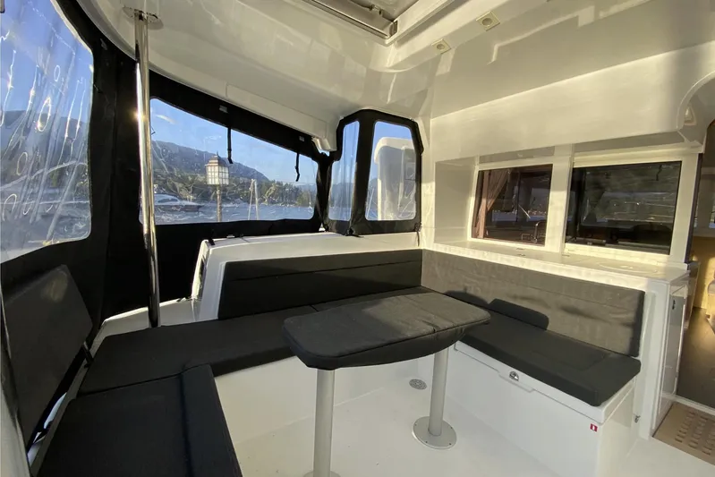 Why Not Yacht Photos Pics Interior of 2019 Lagoon 450F catamaran with seating area and windows.