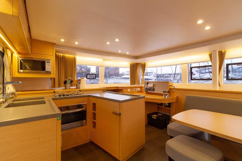 Why Not Yacht Photos Pics Interior of 2019 Lagoon 450F catamaran featuring modern kitchen and dining area.