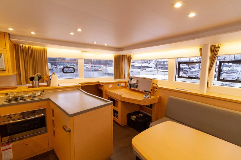 Why Not Yacht Photos Pics Interior of 2019 Lagoon 450F catamaran with modern kitchen and dining area.