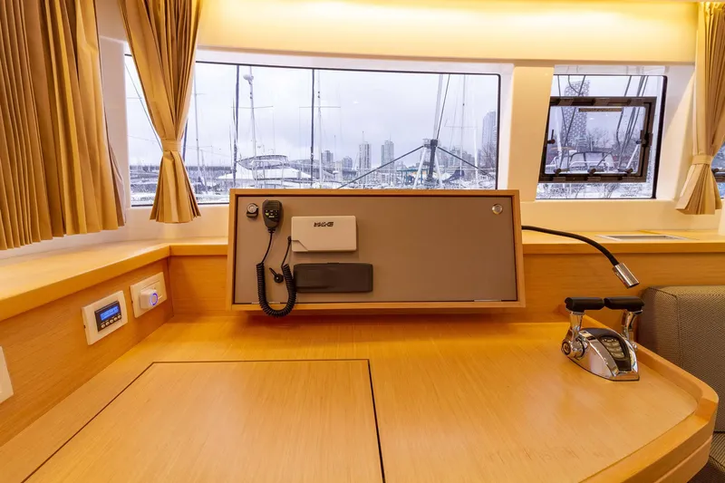 Why Not Yacht Photos Pics Interior of 2019 Lagoon 450F yacht with navigation equipment and marina view.